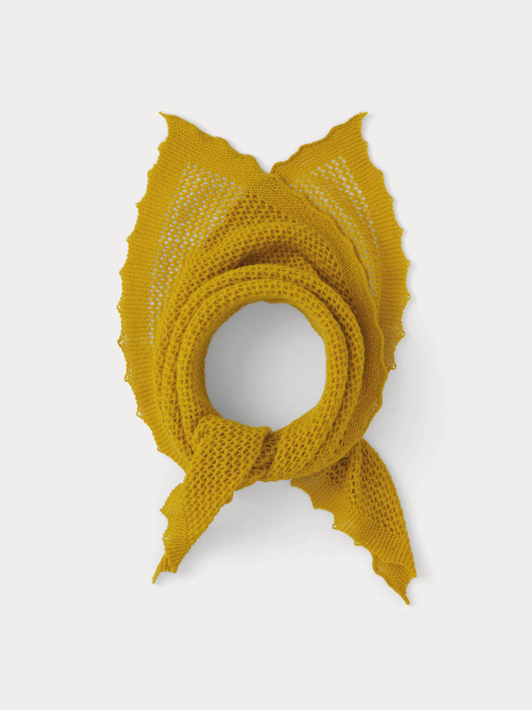 yellow lace triangle scarf tied in a knot