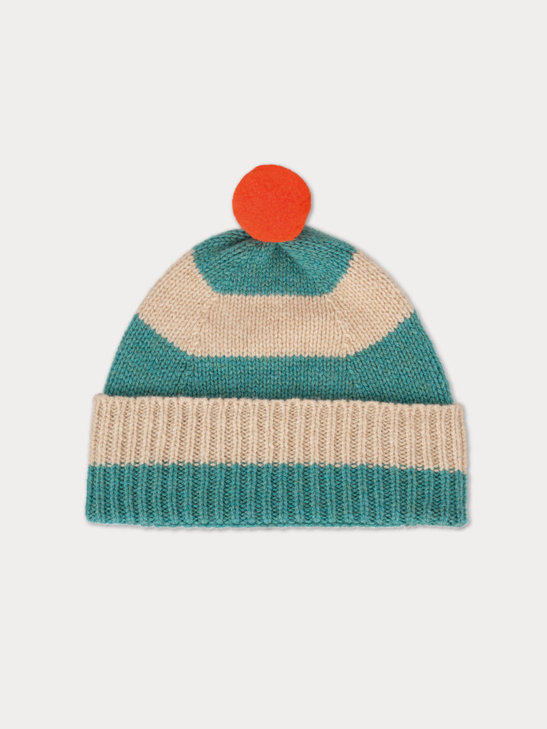 blue and cream striped beanie with  orange pompom
