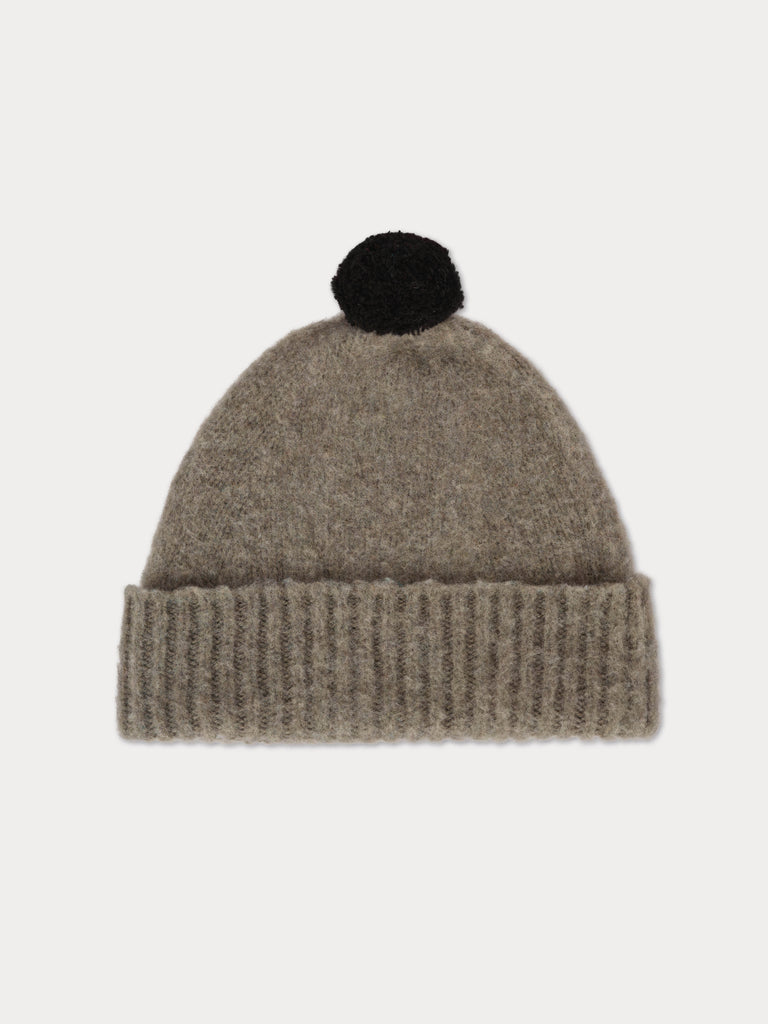 grey beanie with black pompom