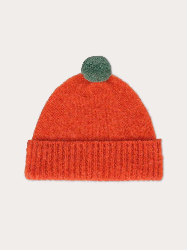 red beanie with green pompom