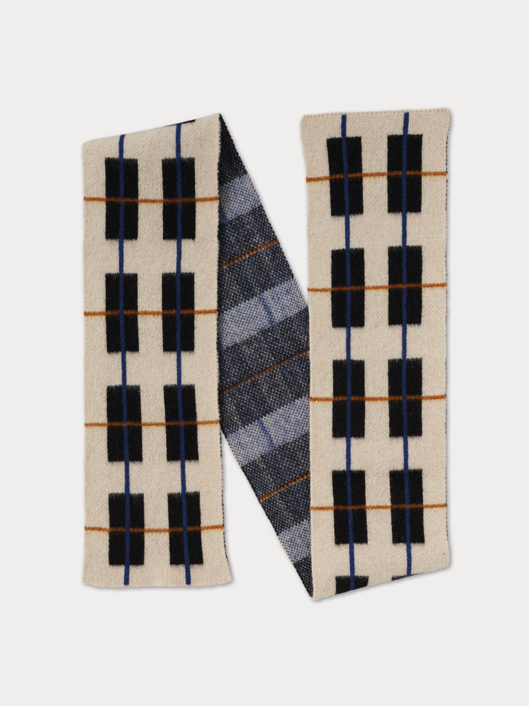 tartan scarf, mainly cream and black with thin, colourful lines