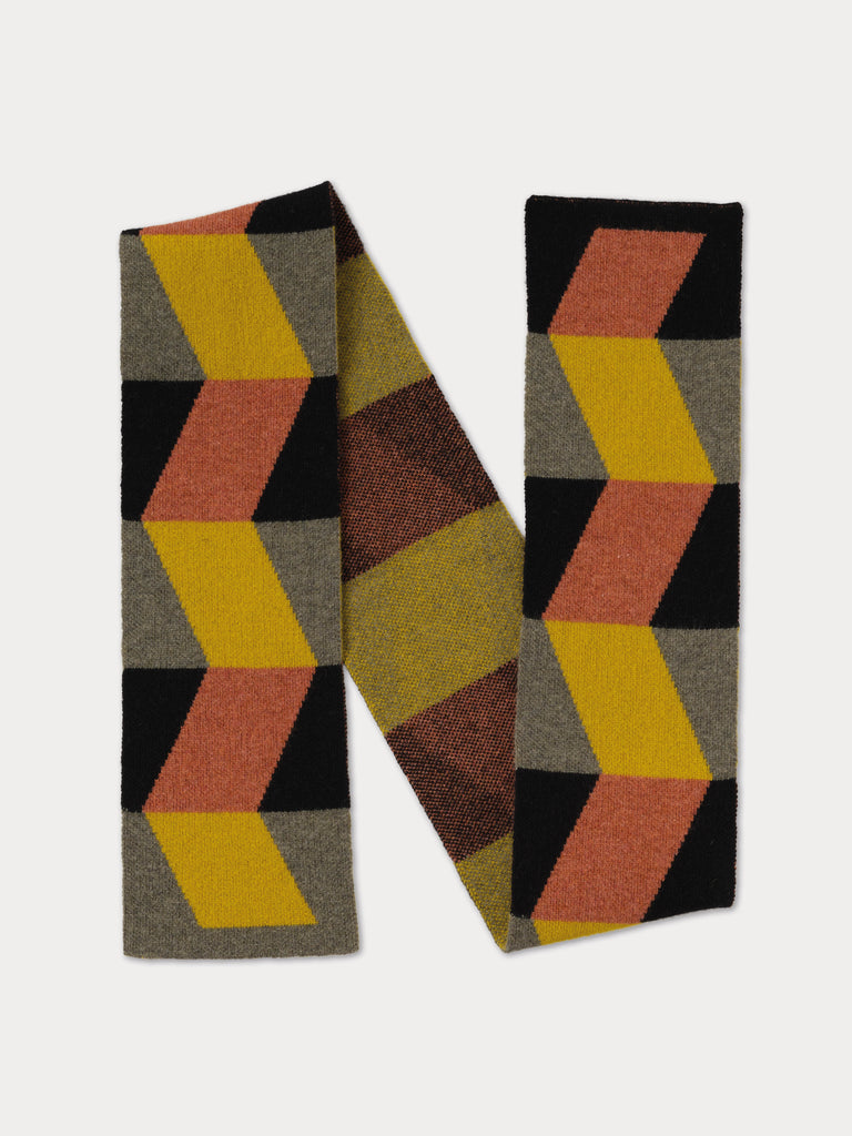 black and grey scarf with geometric yellow and orange zig zag pattern