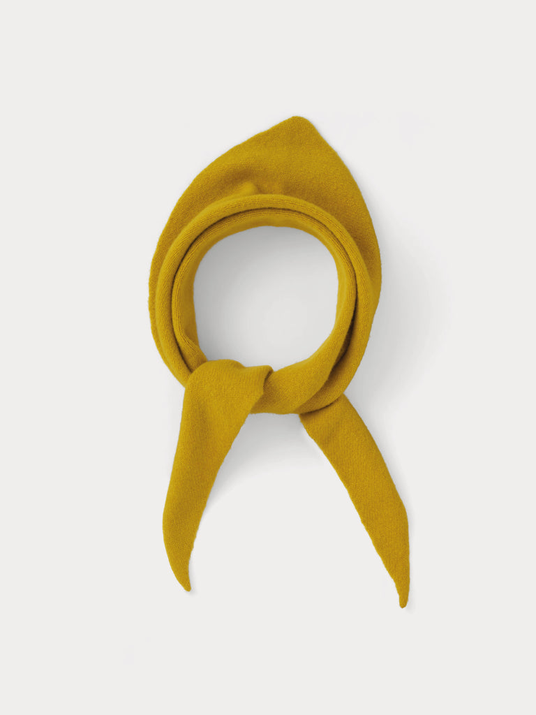 yellow triangle scarf tied into a knot